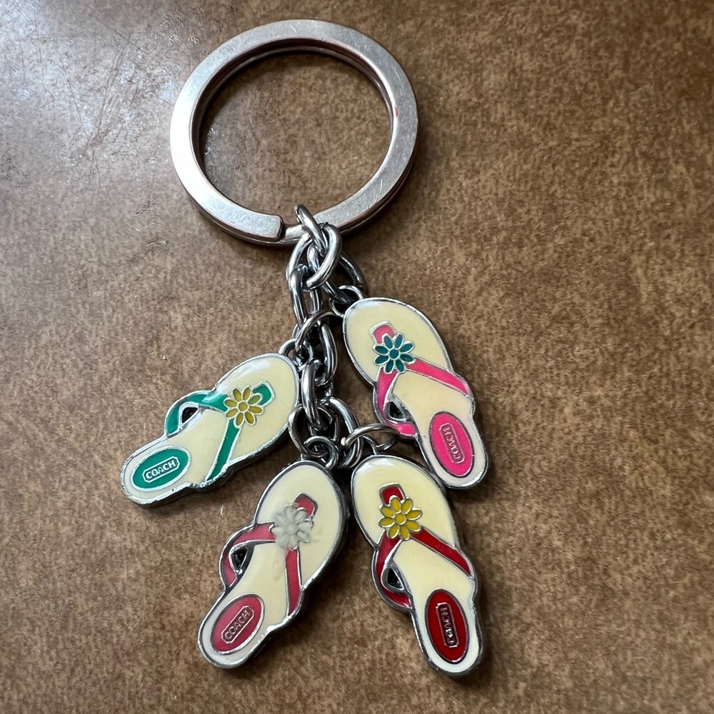 Coach Enamel Flip Flop Keychain in Cream with Pink, Teal, Red and Plum Accents.